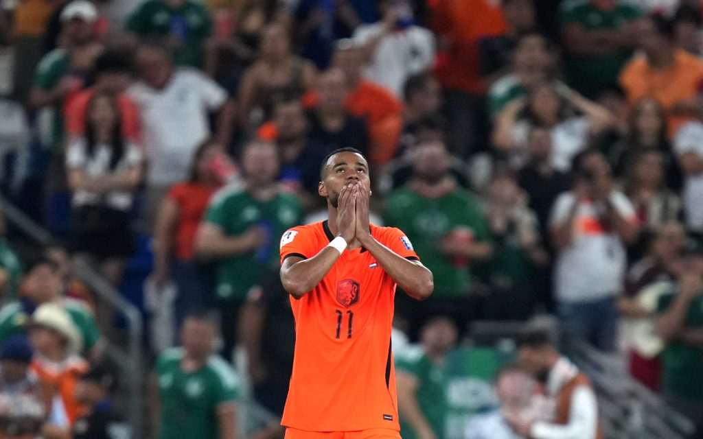 Cody Gakpo reacts after Netherlands' penalty shootout defeat to Morocco — the forward had earlier scored an emotional goal just days after the loss of his unborn son