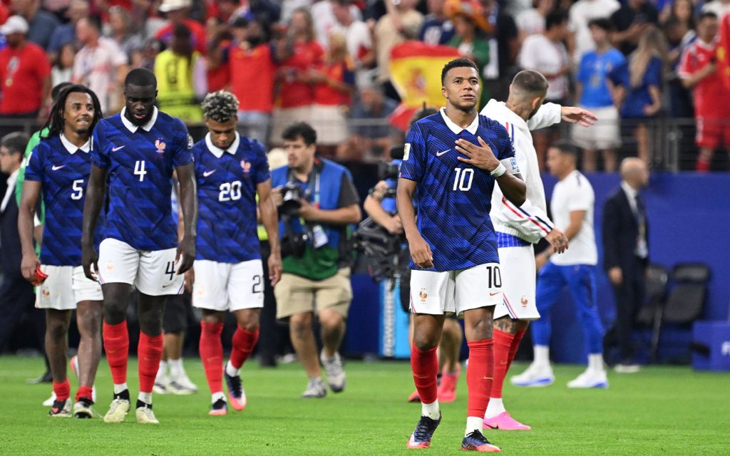 Kylian Mbappé and France's players leave the pitch after their semifinal exit to Spain