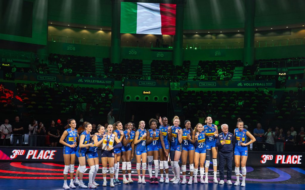 Italy's players celebrate on the podium after beating China for bronze at the Nations League Finals in Macao