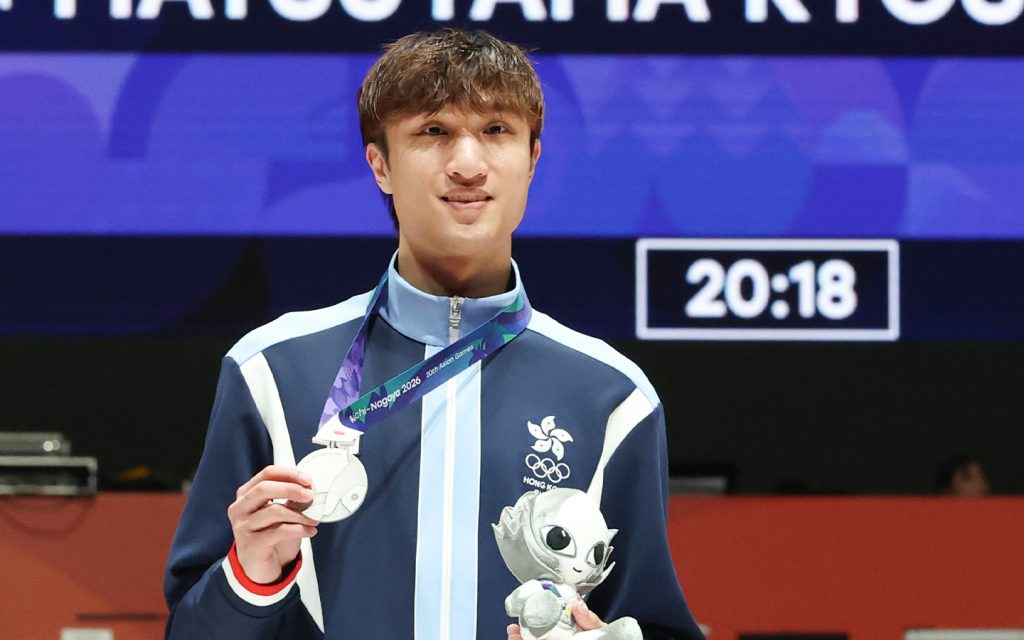 Ryan Choi reacts at the awarding ceremony after winning silver in the men's individual foil final